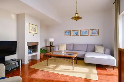 a living room with a couch and a table at Garajau House - Sunrise to Sunset Ocean View Villa in Caniço