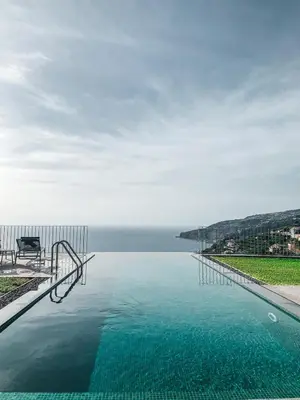 a swimming pool with a view of the water at Casa Atlantico Suite in Ribeira Brava