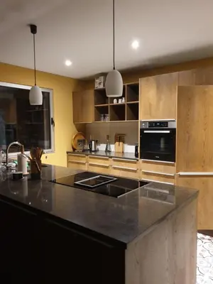 a kitchen with a black counter top and a stove at Casa Atlantico Suite in Ribeira Brava