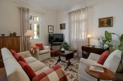 a living room with couches and a tv at Casa dos Terços by An Island Apart in São Vicente