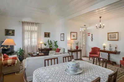 a living room with a table and a couch at Casa dos Terços by An Island Apart in São Vicente