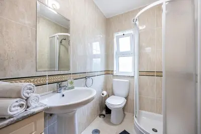 a bathroom with a sink and a toilet and a shower at Casa dos Sonhadores in Aljezur