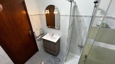 a bathroom with a sink and a shower at Terra Chã Cottage,FEEL Home, in São Vicente