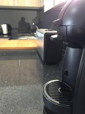 a coffee maker sitting on a counter in a kitchen at Calheta Ocean View Apartments 1 - Air Condition in Estreito da Calheta