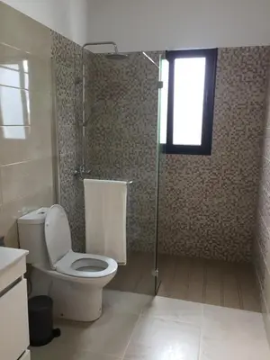 a bathroom with a toilet and a shower at Calheta Ocean View Apartments 1 - Air Condition in Estreito da Calheta