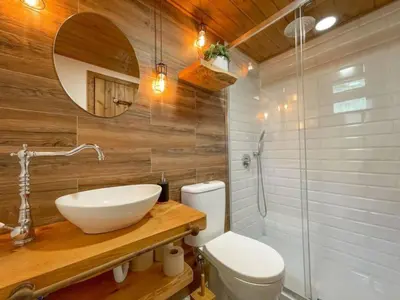 a bathroom with a sink and a toilet and a shower at Mountain Eco Shelter 1 in Funchal