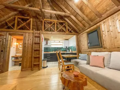 a living room with a couch and a table at Mountain Eco Shelter 1 in Funchal