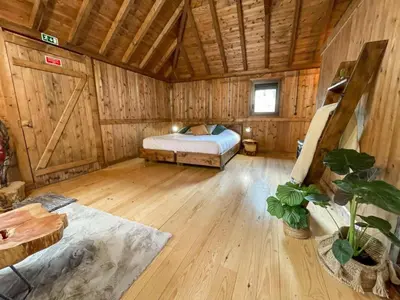 a bedroom with a bed in a wooden cabin at Mountain Eco Shelter 2 in Funchal