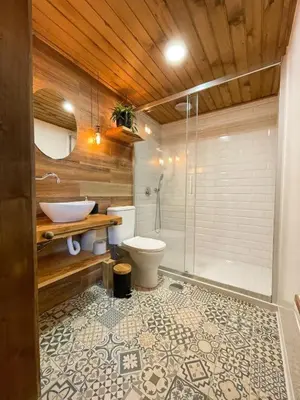 a bathroom with a shower and a toilet and a sink at Mountain Eco Shelter 2 in Funchal