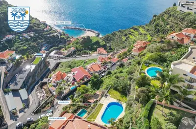 an aerial view of a resort with the ocean at Unique Tropical Style Penthouse with a Dreamy View - by Portugal Collection in Calheta
