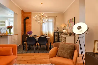 a kitchen and dining room with a table and chairs at Villa Santa Madalena, a Home in Madeira in Arco da Calheta