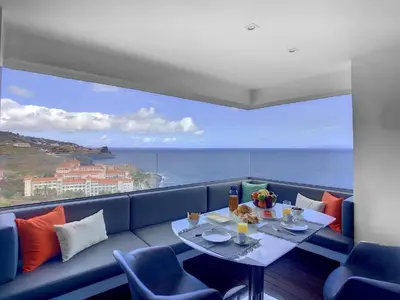 a living room with a view of the ocean at Luxurious Penthouse Suites direct on sea in Caniço