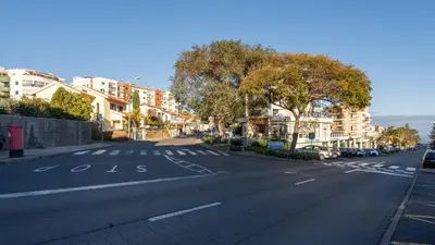 an empty city street with trees and buildings at The Seaview Studio by LovelyStay in Caniço
