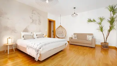 a bedroom with a bed and a swing at The Loft by LovelyStay in Funchal