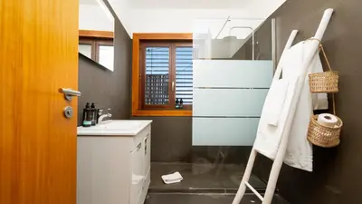 a room with a counter and a bar with a stool at The Loft by LovelyStay in Funchal