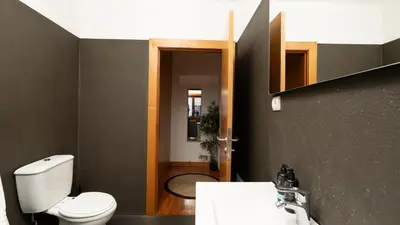a room with a bed and a table with a window at The Loft by LovelyStay in Funchal