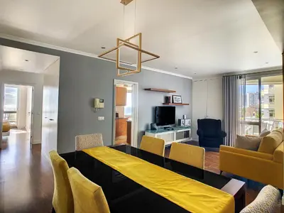 a dining room with a yellow table and chairs at Lido Life Apartment by LovelyStay in Funchal