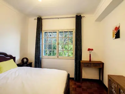 a bedroom with a bed and a window at Casa Bergmann by LovelyStay in Funchal