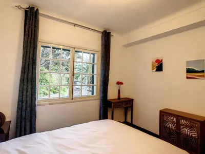 a bedroom with a bed and a window at Casa Bergmann by LovelyStay in Funchal