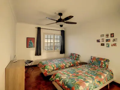 a bedroom with a bed and a ceiling fan at Casa Bergmann by LovelyStay in Funchal