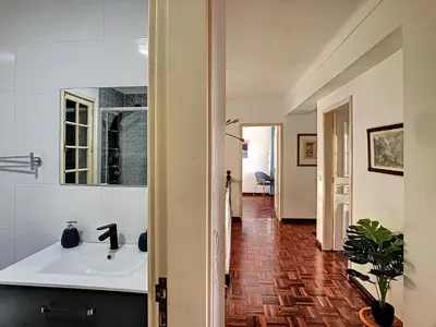 a bathroom with a sink and a mirror at Casa Bergmann by LovelyStay in Funchal
