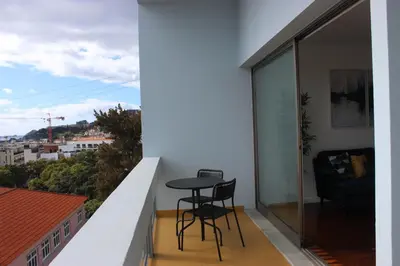 a balcony with a table and chairs on it at D Apartment - your home with breathtaking Views in Funchal
