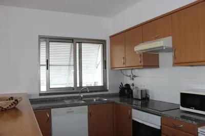 a kitchen with a sink and a window at D Apartment - your home with breathtaking Views in Funchal