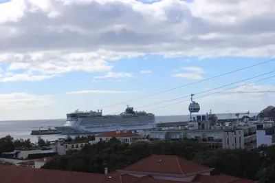a cruise ship is docked in a harbor at D Apartment - your home with breathtaking Views in Funchal