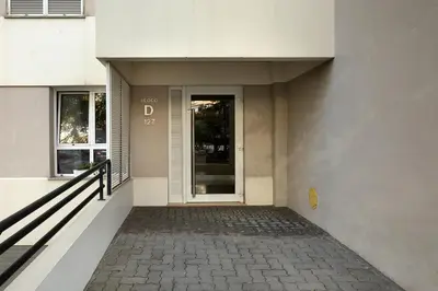 a door to a building with a walkway at Margarida's Apartment com piscina e vista mar in Funchal