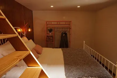a bedroom with two bunk beds in a room at Madeira Black Sand House by Stay Madeira Island in Seixal