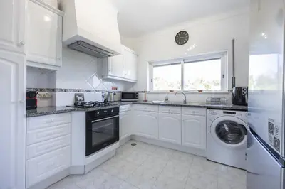 a kitchen with a refrigerator and a washer and dryer at CoolHouses Algarve Luz , 2 Bed apartment w/ sea view, Blue Ocean View (4972/AL) in Luz
