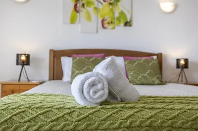 a bedroom with a large bed with a window at CoolHouses Algarve Luz , 2 Bed apartment w/ sea view, Blue Ocean View (4972/AL) in Luz