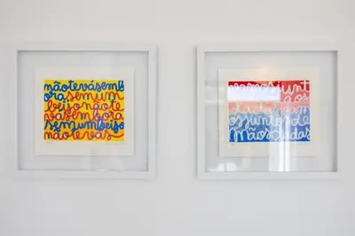 two framed pictures on a wall in a room at Villa Botelha in Sagres