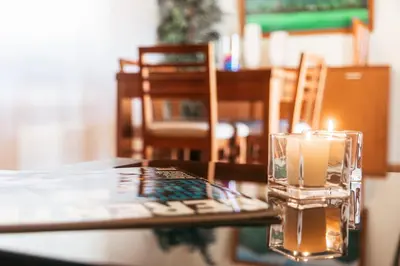 a candle sitting on top of a table at LULINA Two Bedroom by ALMA Holiday Rentals in Funchal