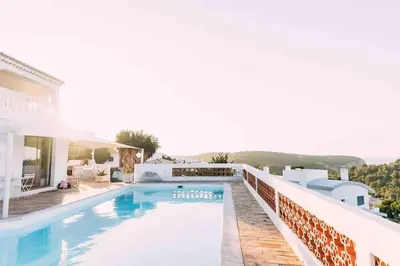 a villa with a swimming pool and a house at Ocean view beach villa in Budens