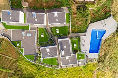 an overhead view of a house with a yard at OurMadeira - Sunset Cliff Villas in Fajã da Ovelha