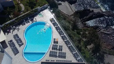 an overhead view of a swimming pool at a beach at Bright Studio in Funchal