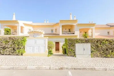a large house with a gate in front of it at Casa Lomy - Boavista Resort and Spa in Quatro Estradas