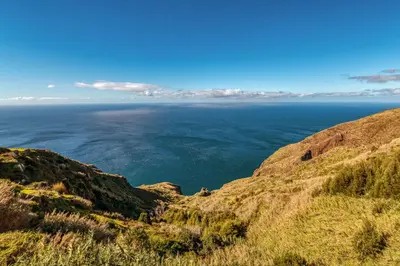 a view of the ocean from the side of a hill at The Cliffhouse by LovelyStay in Fajã da Ovelha