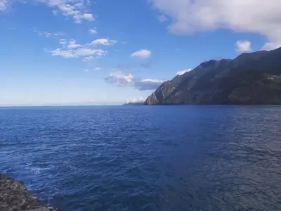 a view of a large body of water with mountains at Desertas View Apartment in Machico