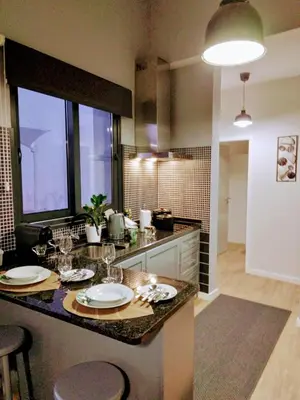 a kitchen with a counter with plates and glasses on it at Anjos's Choice in Ponta do Sol
