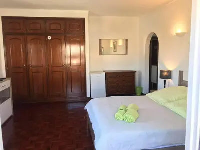 a bedroom with a bed with two towels on it at Lagos Room Booking in Lagos