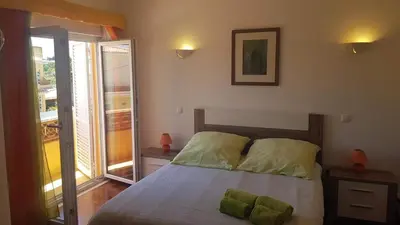 a bedroom with a bed and a large window at Lagos Room Booking in Lagos