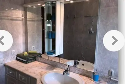 a bathroom with a sink and a large mirror at Lagos Room Booking in Lagos
