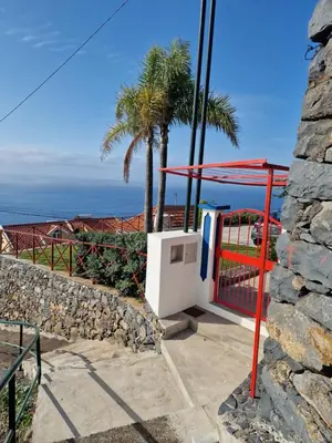a bathroom with a toilet and a sink at Casa Villa Dinastía Sótão Y Casa Villa Dinastía Miramar in Ribeira Brava