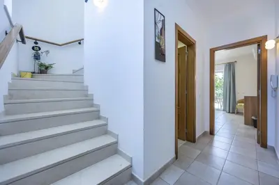 a bedroom with a large bed with a dresser and a window at CoolHouses Algarve Luz, 2 Bed semi detached villa, Jardim das Palmeiras condominium, Villa A in Montinhos da Luz