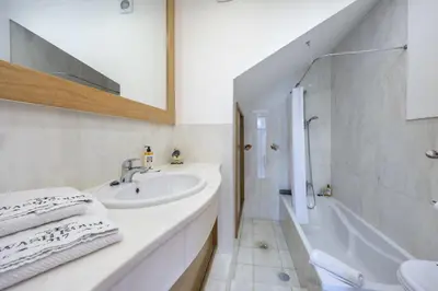 a white and yellow house with a driveway at CoolHouses Algarve Luz, 2 Bed semi detached villa, Jardim das Palmeiras condominium, Villa A in Montinhos da Luz