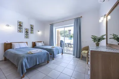 a bedroom with two beds and a balcony at CoolHouses Algarve Luz, 2 Bed semi detached villa, Jardim das Palmeiras condominium, Villa A in Montinhos da Luz