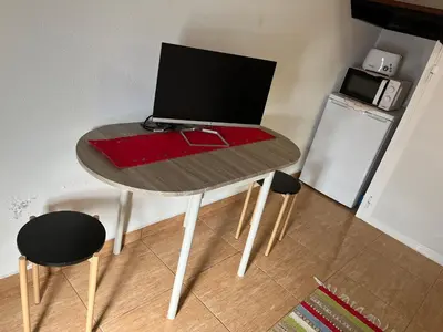 a table with a laptop computer on top of it at Slice of Ponta do Sol - Suite 2 in Canhas