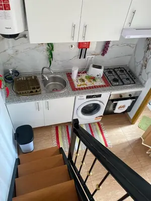 a small kitchen with a sink and a stove at Slice of Ponta do Sol - Suite 2 in Canhas